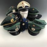 A quantity of post-War German Baden-Wurtemberg Police / Deutsche Polizei caps