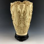 A 1920s faux-ivory vase