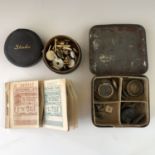 Collectors' items including a stud box and studs, weights and fuel coupons