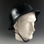 A Second World War M'40 steel helmet, stamped SE66, re-furbished and issued to the German Police