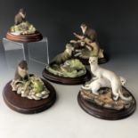 Five Border Fine Arts figurines, comprising of four otters and one mink
