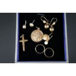 A quantity of gold and yellow-metal jewellery, including a 9ct gold St Christopher pendant, a