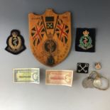Militaria including a Hilden 1949 painted wooden plaque, an AFS lapel badge, and three identity