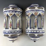 A pair of large faience wall pockets, 46 cm