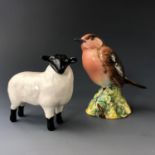 A Beswick robin, (No. 980) and a sheep figurine