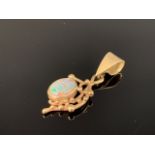 A 9ct gold and opal pendant, the opal cabochon of approximately .75ct, bezel set and suspended