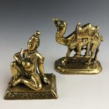 A late 19th / early 20th Century Indian brass figure modelled as a snake charmer, together with