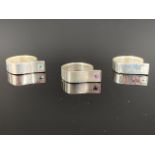 Three contemporary white metal (tests as silver) dress rings set with princess-cut gemstones, 16.1g