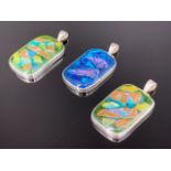 Three contemporary white metal (tested as silver) and dichroic glass pendants, each approximately