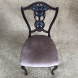 A late 19th century carved mahogany salon chair