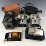 Two Kodak Brownie Starmite cameras, together with a Kodak Six-20 Brownie C, a Kodak 36 Instamatic,