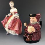 A Royal Doulton figurine Southern Belle HN 2229 and Falstaff character jug