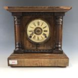 A late 19th Century walnut mantle clock
