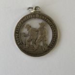 A late 19th Century Dutch / Germanic white metal fob medallion