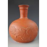 A Meiji Japanese Tokoname "redware" bottle vase, of oblate form with a slender neck, decorated