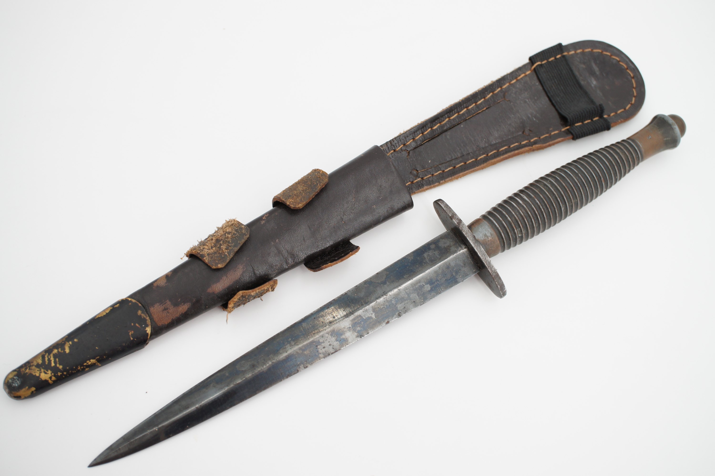 A Fairbairn Sykes / FS third pattern fighting knife, the grip bearing mould mark 3