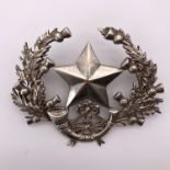 A Cameronians silver cap badge, smith's mark indistinct, London, 1916