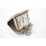 A George V silver cased purse / bedside watch, having a silvered face, luminescent Arabic numerals