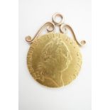 A 1789 gold spade Guinea coin, with suspender, 9.1 g