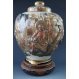 An uncommonly large Meiji Japanese Satsuma vase and cover, of shouldered and inverted baluster form,