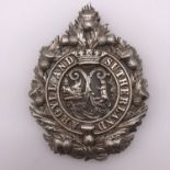 An Argyll & Sutherland Highlanders silver cap badge, bearing retailer's plaque of Brook & Son,