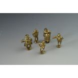 Five novelty brass figural pipe tampers, tallest approximately 4.5 cm, late 19th / early 20th