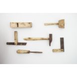 A quantity of 19th century miniature bone hand tools, including a chisel, woodworking plane and