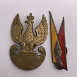 A Second World War Free Polish Army cap badge, in electroplated brass, the screw back marked "F M