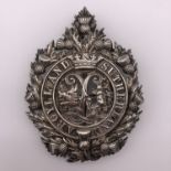 An Argyll & Sutherland Highlanders silver cap badge, an uncommonly heavy example, bearing retailer's