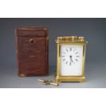 A late 19th / early 20th Century carriage clock in original transit case, 10.5 cm excluding handle