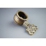 A late 17th / early 18th Century brass pocket nutcracker, bearing engraved initials 'R H', 5.5 cm (