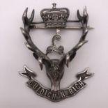 A Seaforth Highlander's officer's cap badge, bearing the retailer's marks of MacDougals of London,