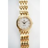 A contemporary lady's Omega diamond-set 18ct gold De Ville Prestige bracelet wrist watch, having a