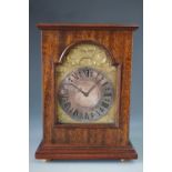 An Elizabeth II Silver Jubilee commemorative mantel clock by Charles Frodsham, having a gilt face