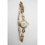 A lady's vintage 9ct gold cased Rotary wrist watch on a 9ct gold flexible bracelet strap, with 17