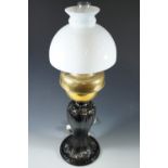 A composite oil lamp on cast brass base, converted to electricity
