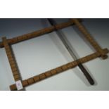 A vintage confectionary- or toffee-cutting knife and wooden frame
