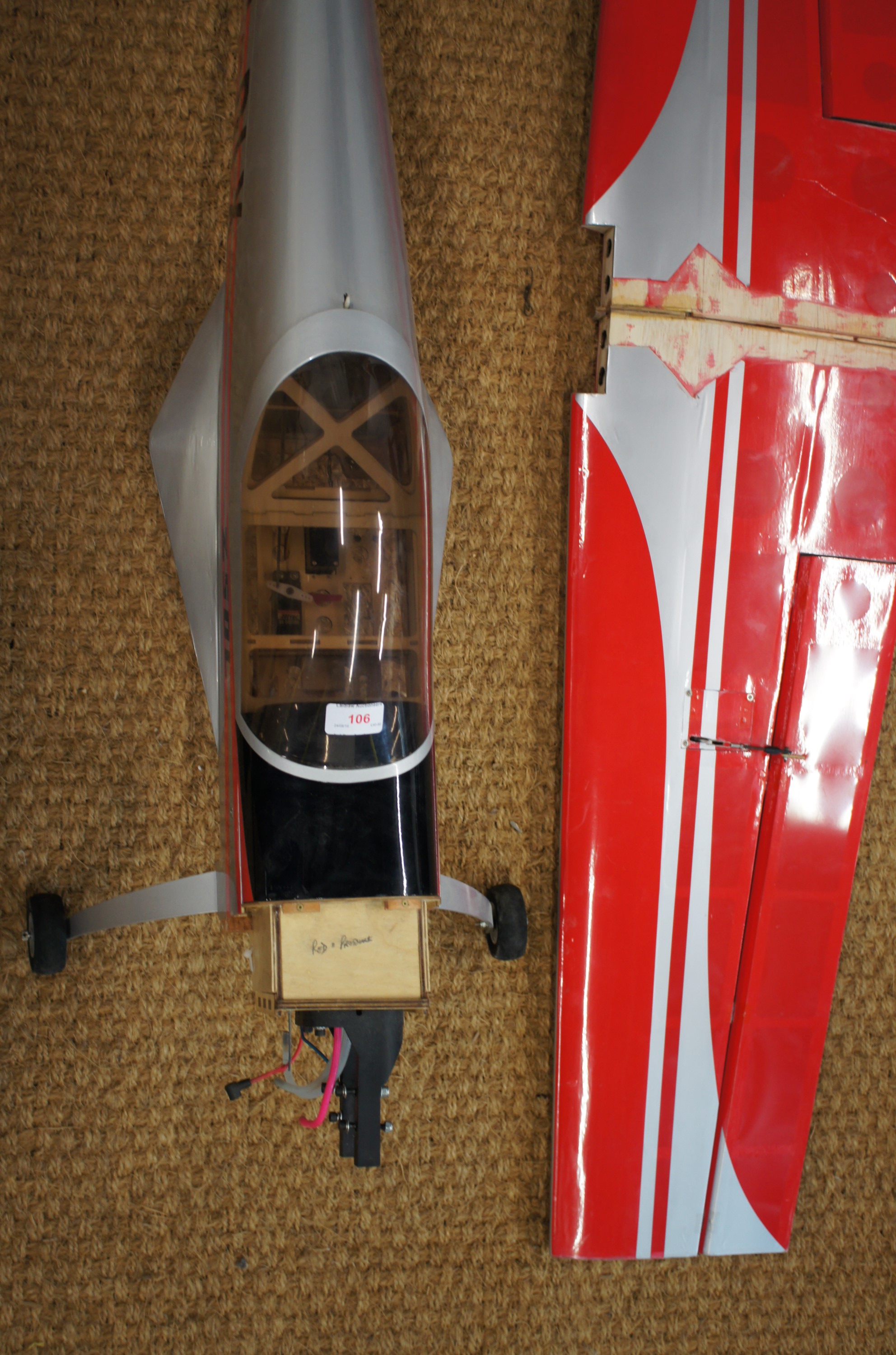 A large remote control model aircraft silver and red EC-DLX wingspan 63" (160 cm) Length 4' (122