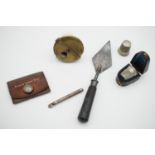Sundry collectables including Victorian miniature trowel, thimbles and case, patent ink well etc.