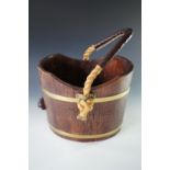 A traditional coopered coal or log bucket