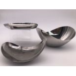 Two Georg Jensen stainless steel bowls / dishes, and one further unnamed example, largest 22 cm