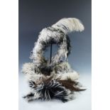 A Belle Epoque lady's black-and-white ostrich feather circlet and matching stole, two hair plumes,