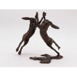 Michael Simpson (Contemporary) A limited edition bronzed sculpture of two boxing hares