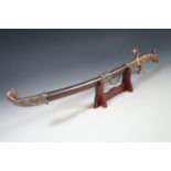 A Chinese decorative sword and stand, 65 cm
