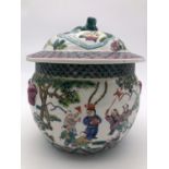 A Chinese famille vert covered jar, polychrome enamelled with figures playing instruments, 23 cm
