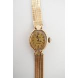 A lady's 9ct gold cased Accurist cocktail watch on a 9ct gold bracelet strap, 15.3g total (running)