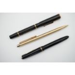 A Parker Slimfold fountain pen, together with a Swan self-filler and a Papermate propelling pencil