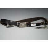 A Girl Guides belt with whistle etc