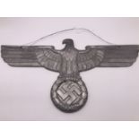 A large cast alloy German eagle and swastika plaque, 67 cm span