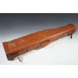 A vintage leather leg of mutton shotgun case